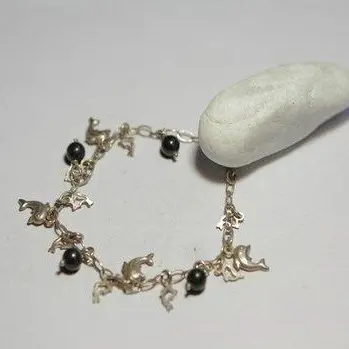 Bracciale bronzo con delfini